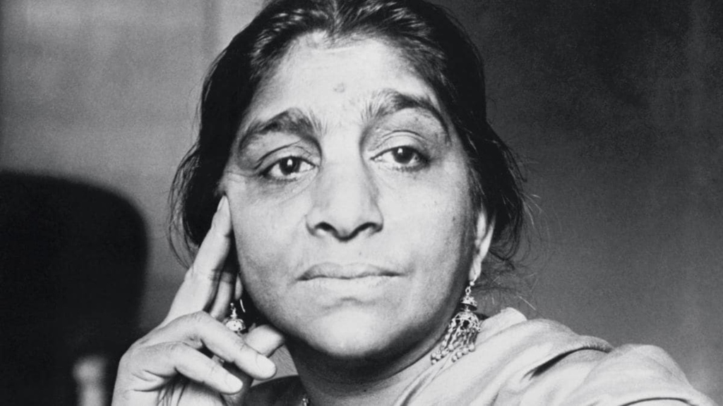 Black and White photo of Sarojini Naidu  with her hand lightly supporting her head by being placed on her cheek 
